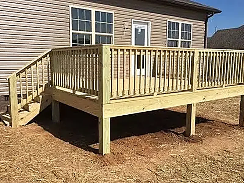 Pressure-treated wood deck with railing on a Sevierville home